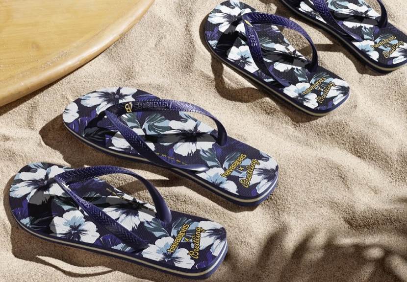 Fotos dos chinelos havaianas com a marca de relógios suiços breitling.