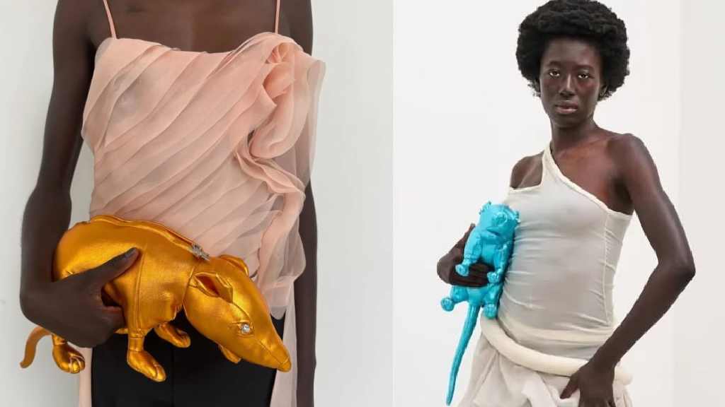 Montagem de modelo segurando a cluth em formato de rato durante a semana de moda de copenhagen.