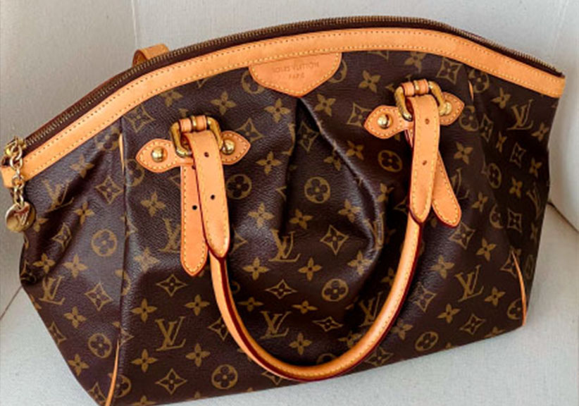 Foto da Bolsa Louis Vuitton Tivoli, modelo espaçoso com zíper para ir para faculdade.