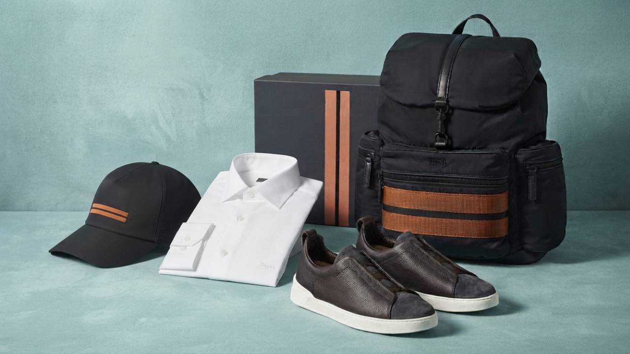 peças da marca ermenegildo zegna: camisa, mochila, tenis e boné.